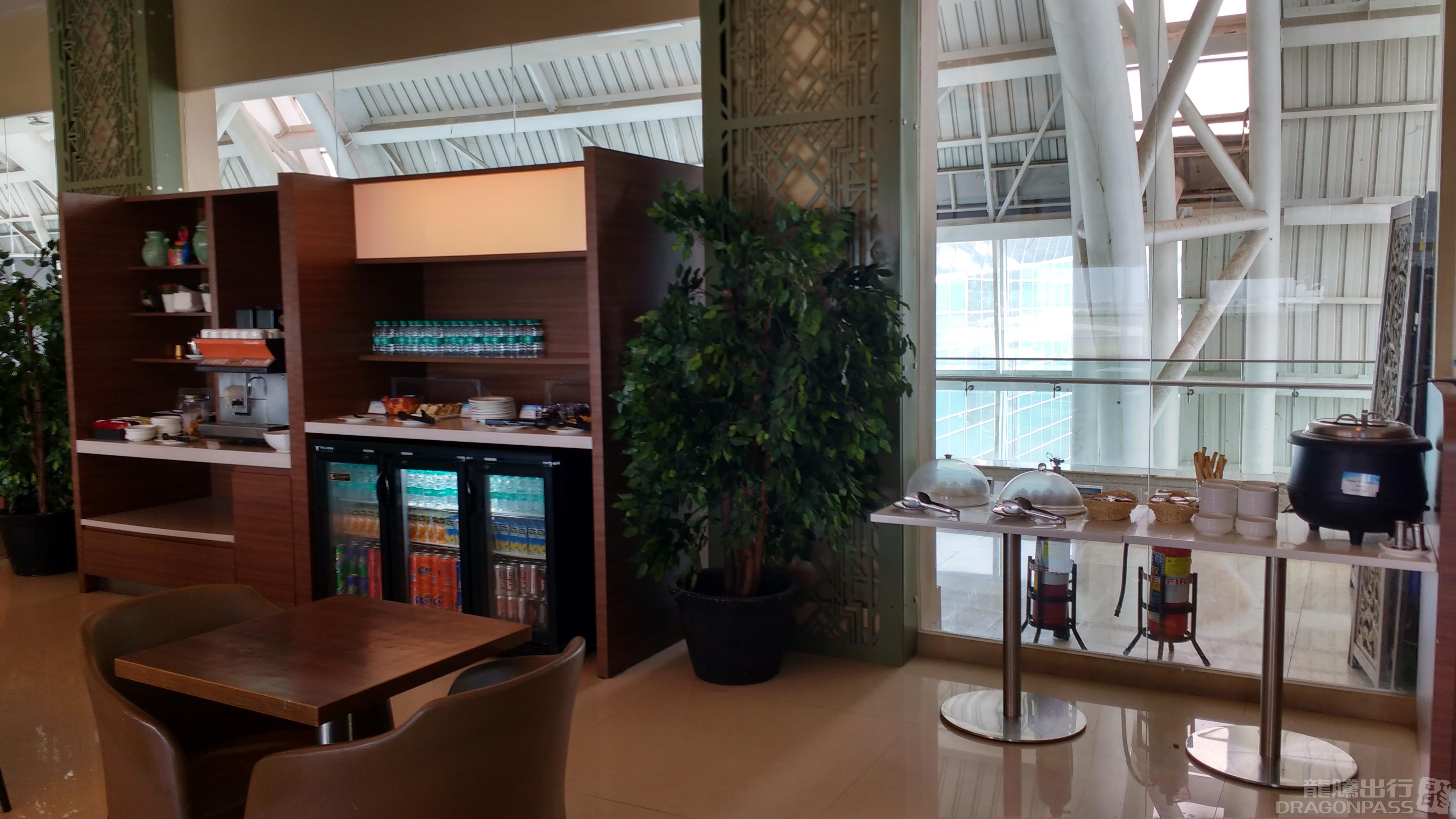 Travel Club Lounge - New Terminal 2 — food & bar